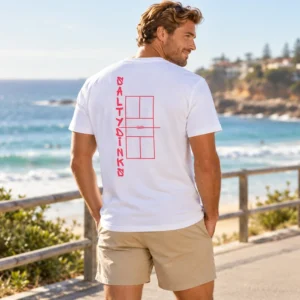 Salty Dinks Court Performance Tee โ Mens shown in a coastal lifestyle setting