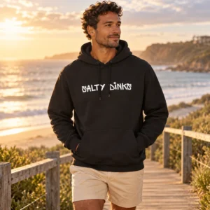 Salty Dinks Unisex Court Outline Hoodie shown in a coastal lifestyle setting